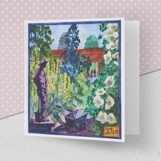 image of the greeting card illustrating the month of June at Kew Gardens, with a wheelbarrow and the lots of plants covered with flowers in the foreground. 