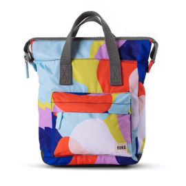 Front view of the backpack on a white background. the backpack is made with a blue, pink and yellow print with grey handles and zip