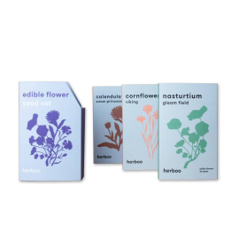 Image of the seed set with the three different packets of edible flowers seed variety.