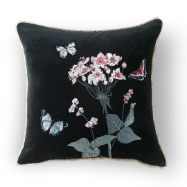 Square dark charcoal velvet cushion with light fraying. Embroidered light pink flowers and three butterflies.
