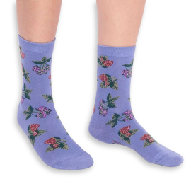 Front view of the socks in a pale blue colour base with a pattern of strawberries and raspberries.