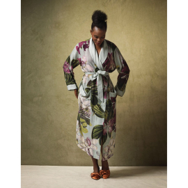 Lifestyle image of the front of the 'Protea flower' print gown worn by a model.