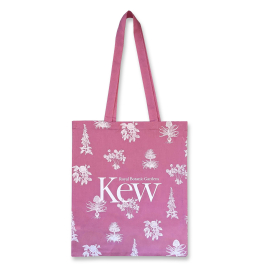 Image of the tote bag with white floral design and Kew logo on a pink base. 