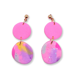 Love Kiki x Kew stud dangle earrings featuring two polymer clay circles. One in a bright pink and the other with hints of purples, blues and yellows with iridescent specks. Studs in gold colour.