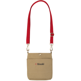 Image of the Niwaki pouch featuring a red canvas strap and gold detailing. The Niwaki name and red logo is positioned in the centre of the bag.