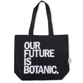 Black 100% organic tote bag featuring the text 'OUR FUTURE IS BOTANIC' in white and Kew label.