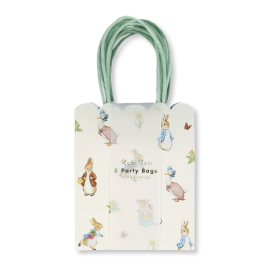 Image of the mini party bags viewed from the front. The bag is in cream colour with picture of Peter Rabbit and his friends all over. The top edge is scalloped and the handles are in duck egg colour.