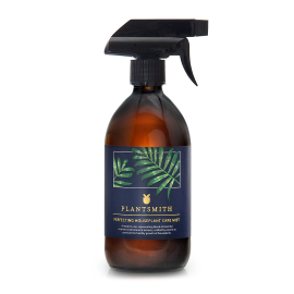 On-white image of Houseplant care mist with white label with palm design and reads: Plantsmith Perfecting Houseplant Care Mist. A ready to use, rejuvenating blend of essential nutrients and botanical extracts, crafted by experts to promote the healthy gro
