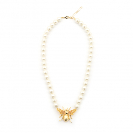 The necklace features an oversized bee with rich 18ct gold plate, hues of yellow enamel fill the intricate wings. Set on a stand of simulated cream pearls