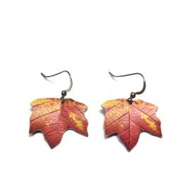Maple leaf earrings in a rust red and gold with sterling silver wires.