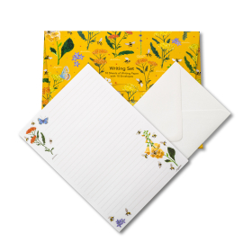 Yellow writing set with paper and envelope on display.