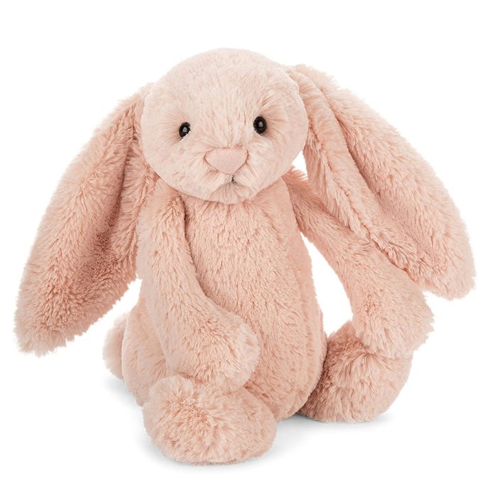 Blush fluffy bunny with two floppy ears and bead eyes.