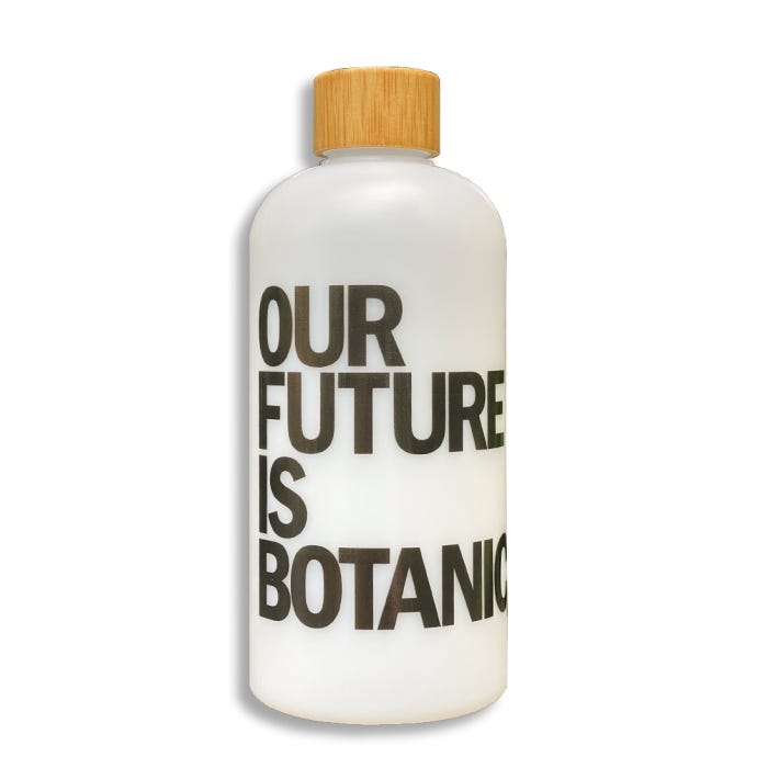 Sugarcane bottle with text reading 'Our future is botanic' in capital letters. Wooden and bamboo lid.