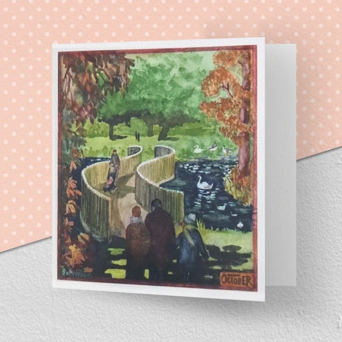 image of the greeting card illustrating the month of October at Kew Gardens, featuring the Sackler crossing bridge framed by autumnal trees.