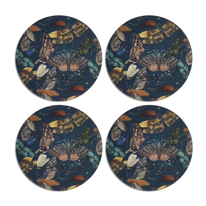 Image of midnight blue four cork-backed placemats featuring the intricate artwork from the famous Royal Botanic Gardens, Kew's archives. Intricate patterns and colours from a diverse range of bugs.