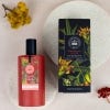 Red bottle of the Bergamot and Ginger Eau de Toilette with label and black lid. Packaging features botanical illustration.