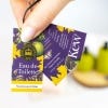 Hand holding the three Narcissus Lime Eau de Toilette labels