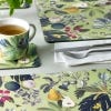 Lifestyle image of a table scene with the matching mug, coaster and placemat.
