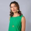Hammered Tropical Leaf Large Pendant Necklace by Just Trade, close up of the pendant, lifestyle image