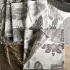 Lifestyle image of set of four napkins inspired by the stunning and intricate artwork found in the extensive Royal Botanic Gardens, Kew. Light grey napkins with darker grey artwork of insects including butterflies and dragonflies. Kew logo featured in bot