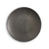 One of the black plates in the set of four depicting a close up design of a winged insect.